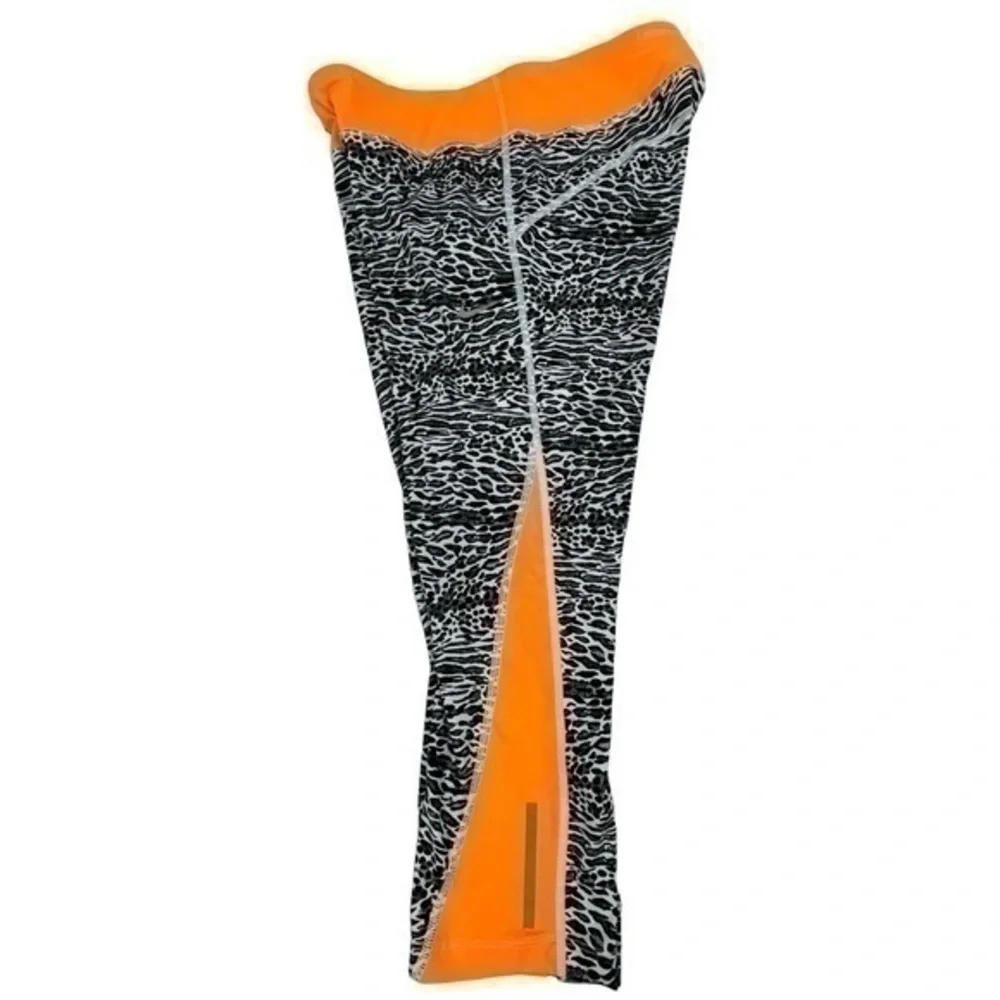 Nike Dri-Fit Women Cropped Leggings Medium | Black White Orange